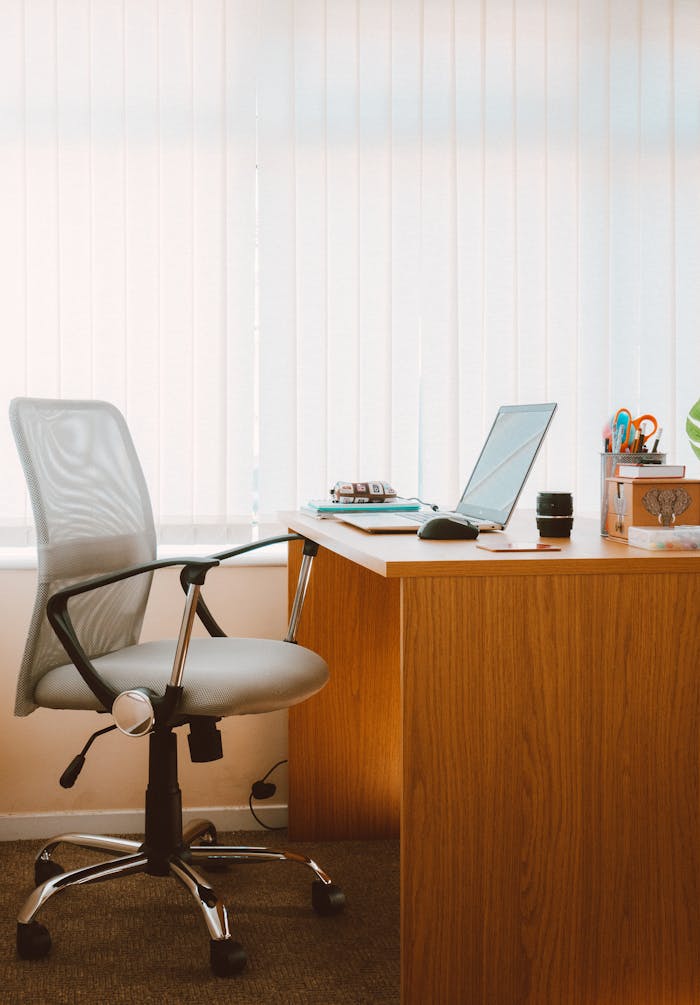 Mastering the First Impression: Your intriguing post title goes here A tranquil modern home office featuring a wooden desk, ergonomic chair, and soft natural light.