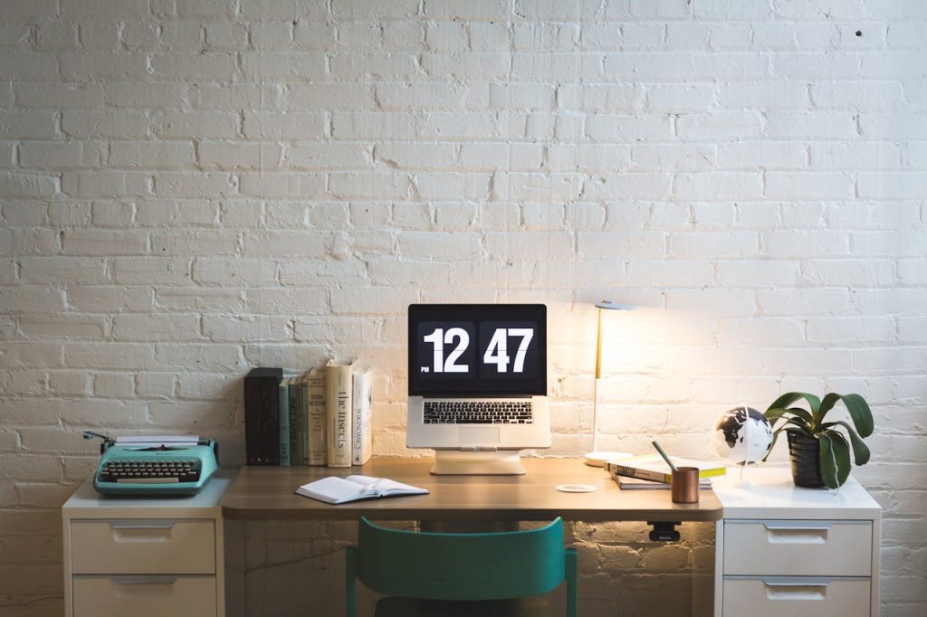 Elegant workspace featuring a computer on a sleek desk, ideal for work and creativity.